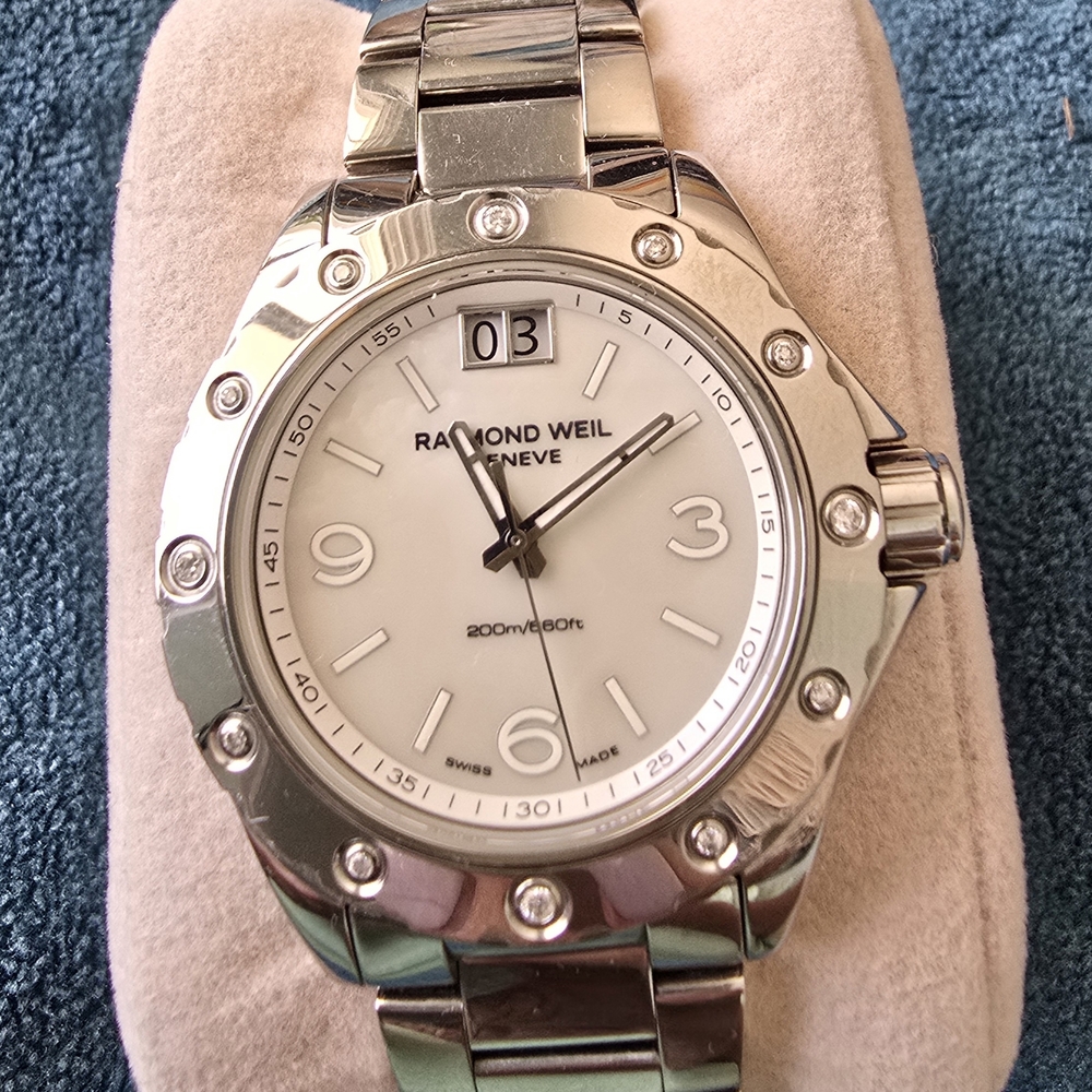 Raymond Weil Silver Watch with White Dial Crystals Around Face.